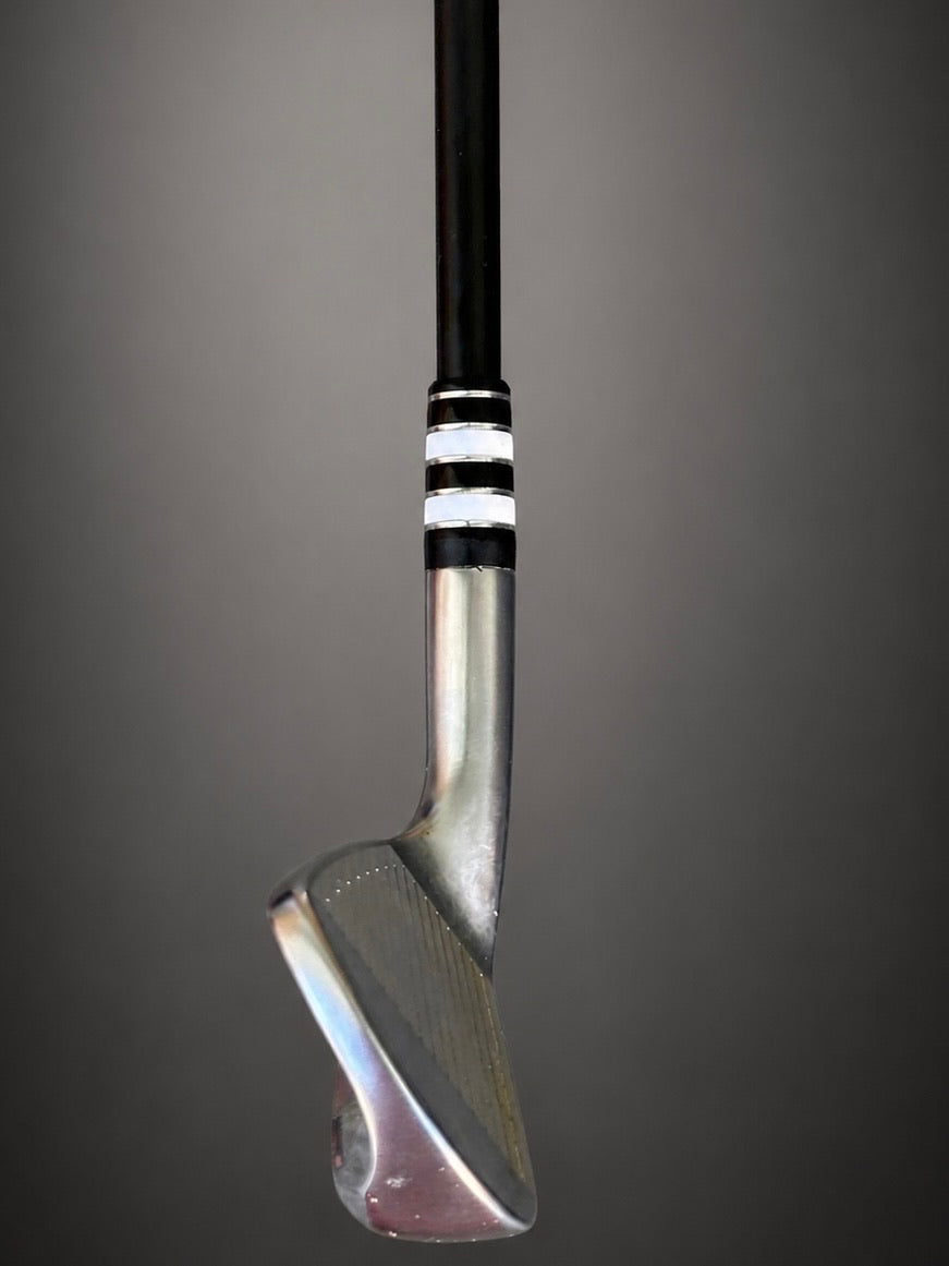 A Classy Jailbird ferrule installed on an iron, seating the black shaft into the polished hosel.